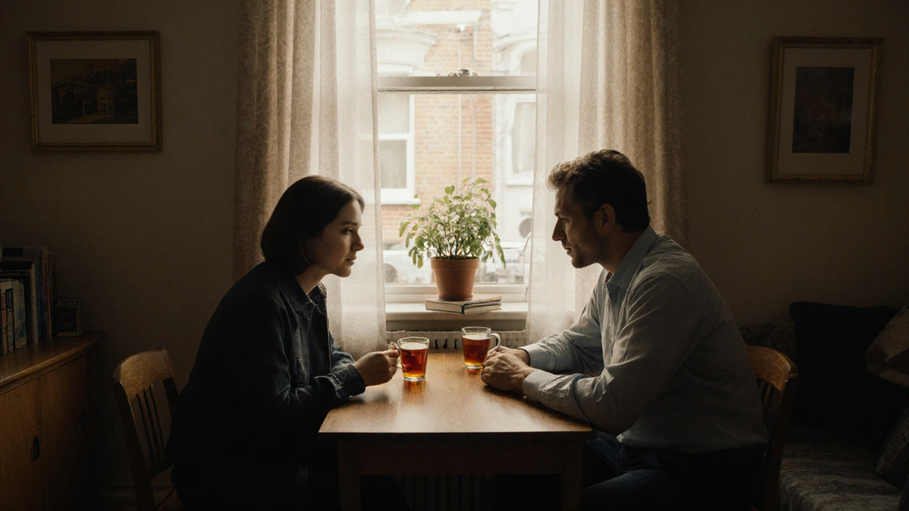 Two people sharing tea at a quiet table in a modest North London flat.