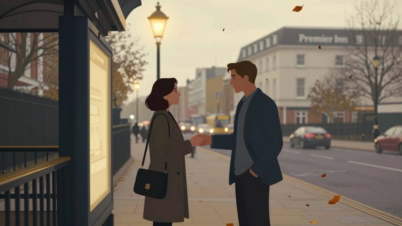 A discreet meeting at Barnet Station entrance with a woman and man exchanging a polite greeting at dusk.