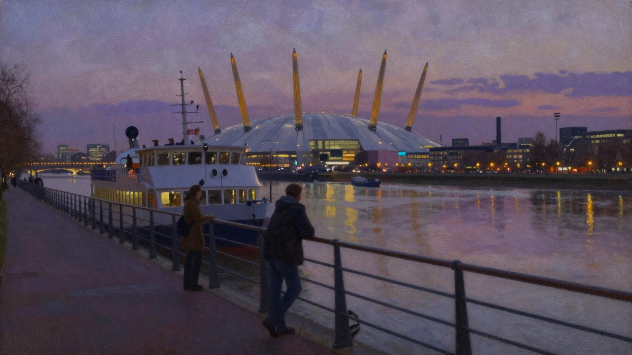 The Woolwich Ferry at dusk with the O2 in the background, two passengers on deck.