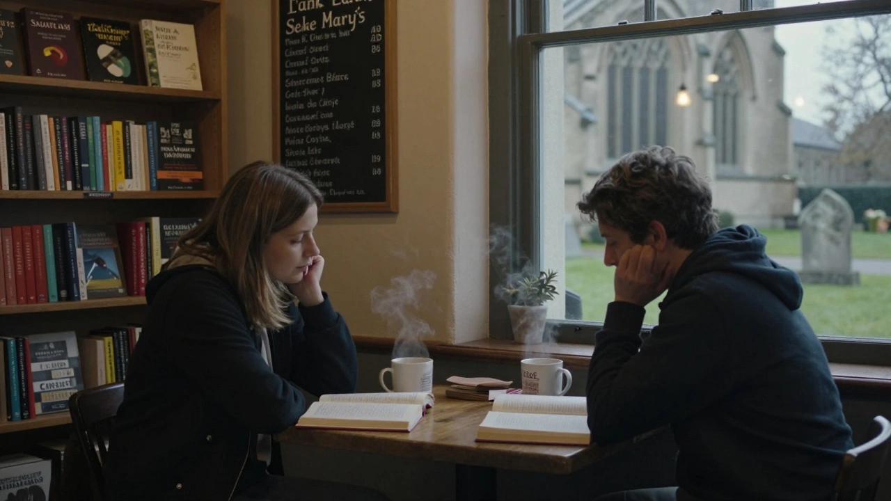 Two people sharing a quiet moment in St. Mary’s Café with books and steaming mugs.