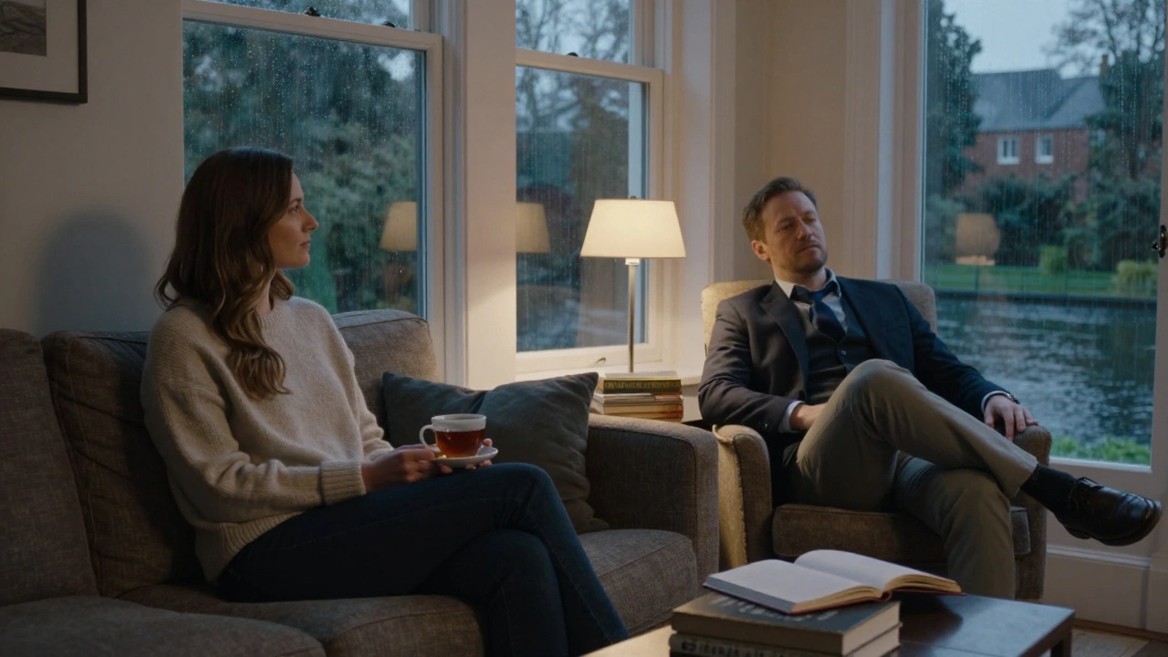 Two people sitting in quiet companionship in a modest canal-side apartment, sipping tea in silence.