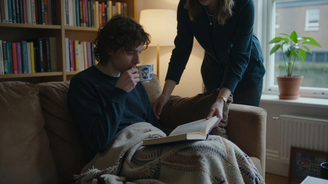 A peaceful moment inside a Paddington flat with someone sipping tea and another placing a blanket quietly.