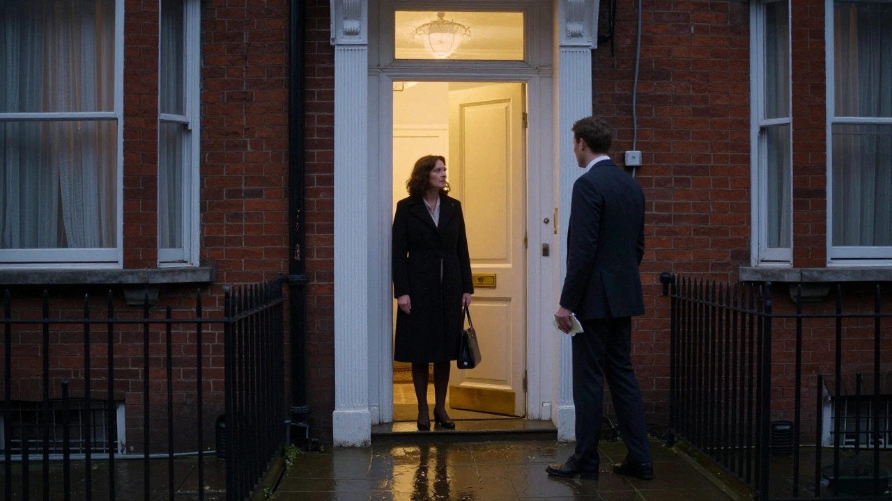 A woman standing at her doorway as a client leaves, cash in hand, under a dim porch light at dusk.