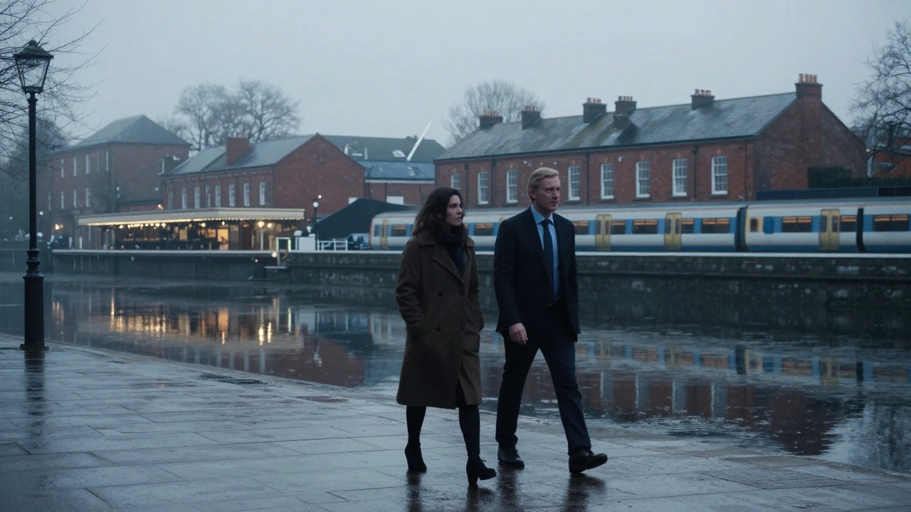 Silhouettes of two people walking silently along Paddington Basin at dawn, reflections in the water.