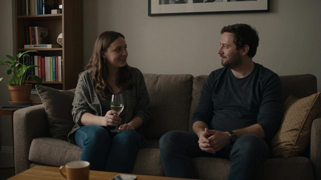 Two people share a calm, private evening in a modest living room with soft lighting.