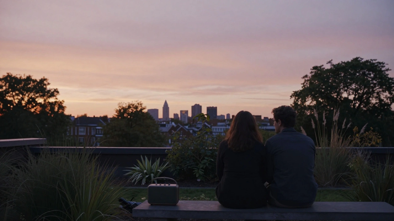 Silhouettes of a couple sit quietly on a rooftop garden bench at sunset, overlooking London’s distant skyline.