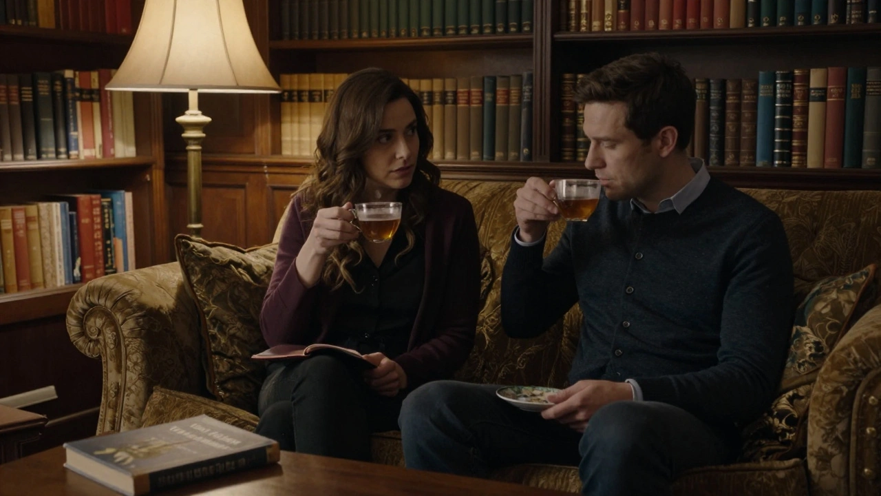 Two people enjoy tea and conversation in a cozy private library filled with classic books, bathed in warm lamplight.
