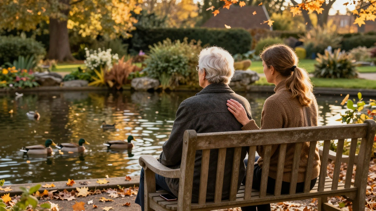 An older client and companion sit peacefully together in a Richmond garden, watching ducks, sharing stillness without words.